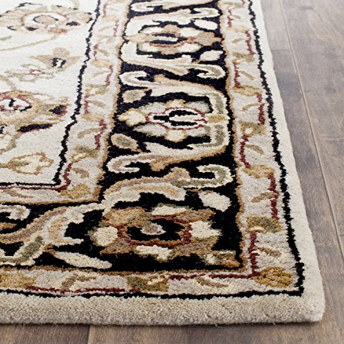 0683726952305 - SAFAVIEH STRATFORD COLLECTION STR501A HANDMADE IVORY AND BLACK WOOL AREA RUG, 5 FEET BY 7 FEET (5' X 7')