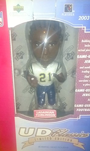 0782870313724 - 2003 NFL UPPER DECK CLASSICS LIMITED EDITION LADAINIAN TOMLINSON BOBBING HEAD FIGURINE W/ COLLECTORS DISPLAY STAND FEATURING A PIECE OF GAME USED JERSEY AND NUMBERED TRADING CARD.