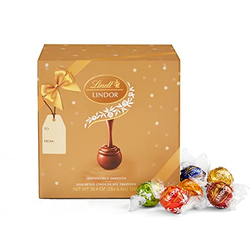 0009542445447 - NEW LINDT LINDOR ASSORTED CHOCOLATE TRUFFLES 90 COUNT HOLIDAY CANDY GIFT BOX, CHOCOLATE CANDY WITH SMOOTH, MELTING TRUFFLE CENTER, 38.4 OZ. BOX